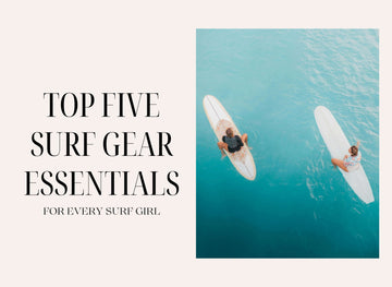 Two female surfers on surfboards in the ocean, highlighting top surf gear essentials for every surfer girl