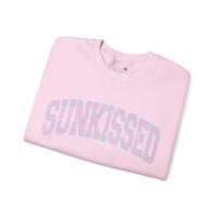 Sunkissed Varsity Light Pink Crewneck Sweatshirt folded, showcasing the light pink color and bold "Sunkissed" print on the front.