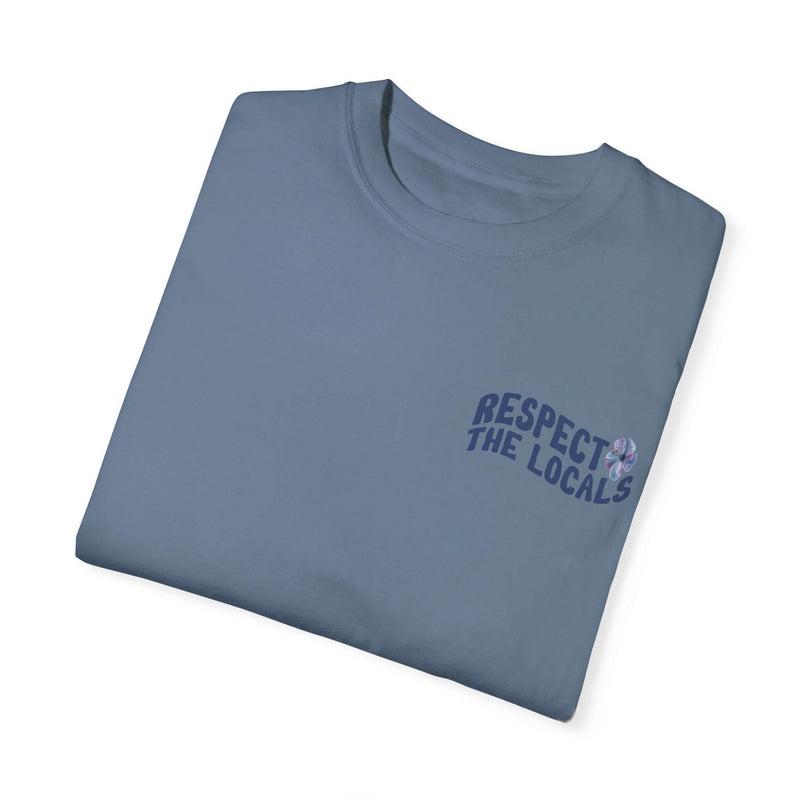 Blue graphic tee with "Respect the Locals" text and whale shark design, symbolizing ocean conservation and environmental awareness.