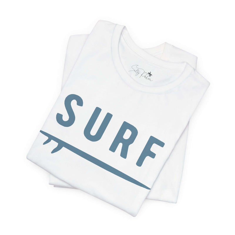 White unisex Surf Graphic Tee with bold lettering, ideal for surf enthusiasts seeking style and comfort in 100% cotton material.