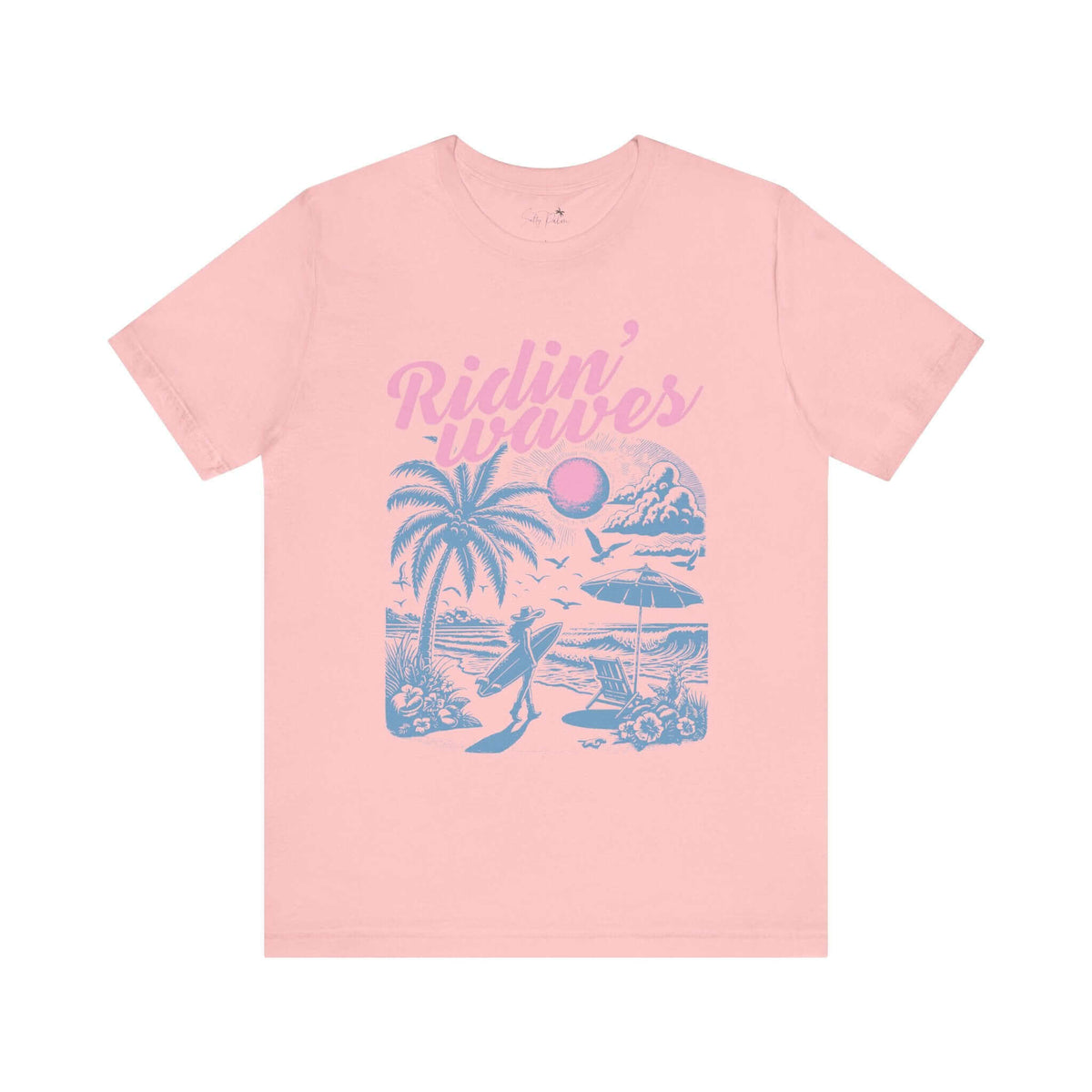 Pink "Ridin' Waves" graphic tee with retro surfboard and coastal cowgirl design, short sleeve, 100% cotton, Bella + Canvas unisex fit.