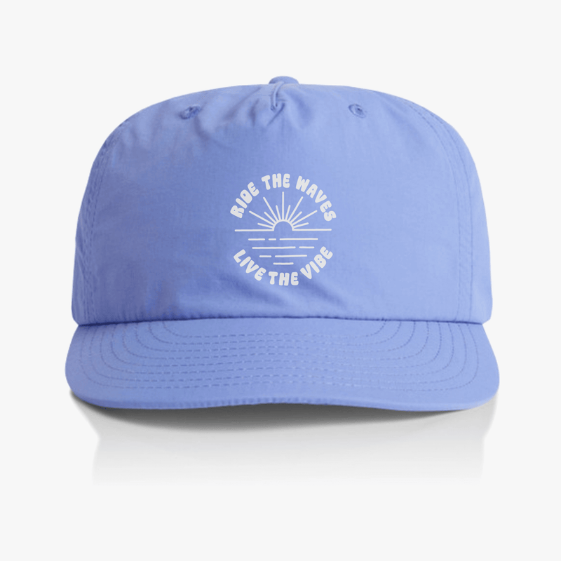 Lapis blue surf cap with "Ride the Waves Live the Vibe" design, made from recycled nylon, ideal for outdoor activities.