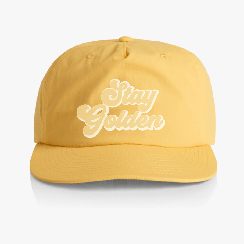 Stay Golden Sunset Yellow Surf Cap in quick-dry recycled nylon with unstructured snapback, perfect for sunny beach days.